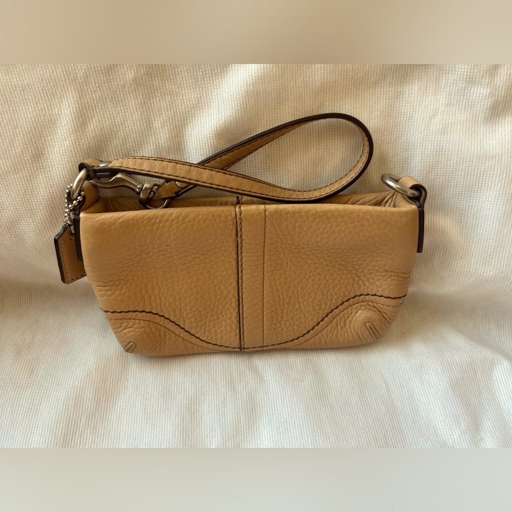 Small tan Coach wristlet.